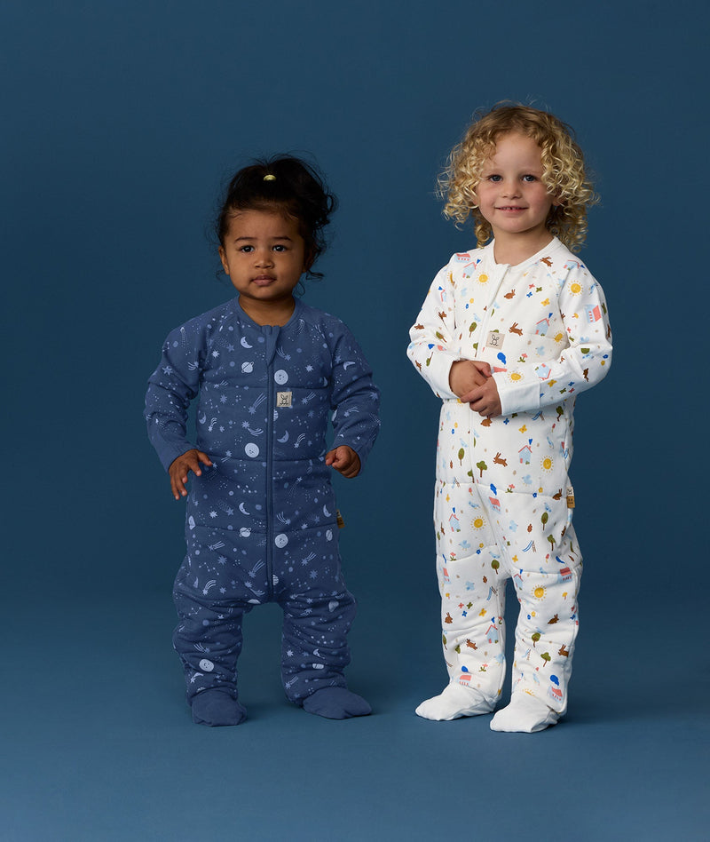 TOG-rated ergoPouch sleeping onesie for babies and kids, made from soft, natural fibres with a relaxed fit for natural movement.