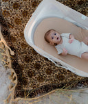 Easy Sleep Portable Bassinet Ecru newborn lying inside