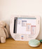 Drift Away White Noise Machine Sage on dresser with What to Wear Guide