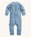 Back view of the ergoPouch Long Sleeve Layer in Cornflower, featuring a unique zip system for easy nappy changes and dressing.
