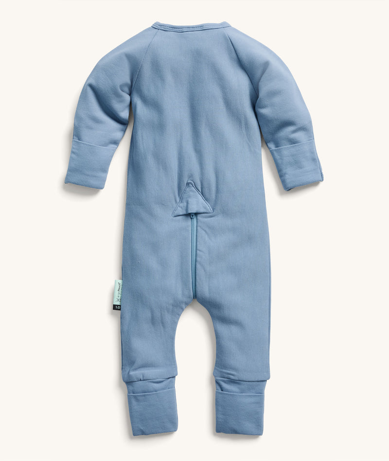 Back view of the ergoPouch Long Sleeve Layer in Cornflower, featuring a unique zip system for easy nappy changes and dressing.