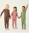 Three preschool kids wearing ergoPouch Long Sleeve Pyjamas in Cocoa, Rose, and Moss.