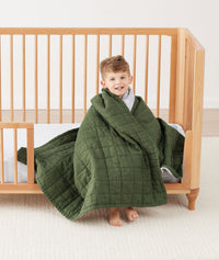 Quilted Coverlet 3.5 TOG Hunter Stripe wrapped around preschooler
