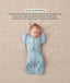 Baby lying on their back in a blue dragonfly-patterned Cocoon Swaddle Bag with a matching Butterfly Cardi, enabling hands-up swaddled sleeping.