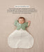 Sleeping baby in a white Cocoon Swaddle Bag with one arm released using a green Butterfly Cardi, accompanied by text explaining how to use it as a transition tool.