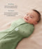 Smiling baby lying on a beige surface being swaddled in an ergoPouch Cocoon Swaddle Bag Willow with text highlighting swaddling benefit and TOG rating feature.