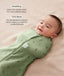 Smiling baby lying on a beige surface being swaddled in an ergoPouch Cocoon Swaddle Bag Willow with text highlighting swaddling benefit and TOG rating feature.
