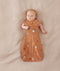 Baby wearing a Cocoon Swaddle Bag 1.0T with its arms out