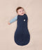 Baby dressed in an ergoPouch Cocoon Swaddle Bag 2.5 TOG with its one arm out.