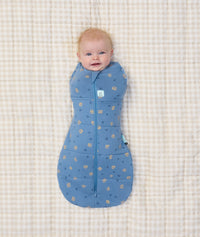 Cocoon Swaddle Bag Petit Pretzel newborn swaddled arms in