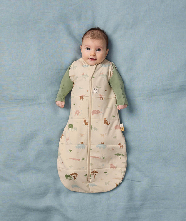 Baby wearing a Safari-themed Cocoon Swaddle Bag with a Long Sleeve Layer underneath.