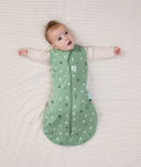 Baby wearing a Cocoon Swaddle Bag 2.5Tog with its arms out