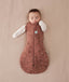 Baby wearing a Cocoon Swaddle Bag 2.5 TOG in Forest Friends with  both arms out
