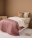 Single bed with convertible quilt and Rosy Gingham coverlet