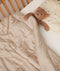 Convertible Cotton Quilt in a Toddler Bed with Toddler Pillow and Teddy Bear