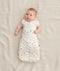 Baby wearing a 0.2 TOG Cocoon Swaddle Bag with its arms out
