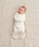 Baby wearing a Cocoon Swaddle Bag 1.0 TOG Desert Bloom