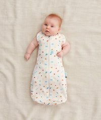 Baby wearing a Cocoon Swaddle Bag 1.0 TOG with its arms out