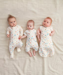 Three babies in ergoPouch sleepwear range in Desert Bloom