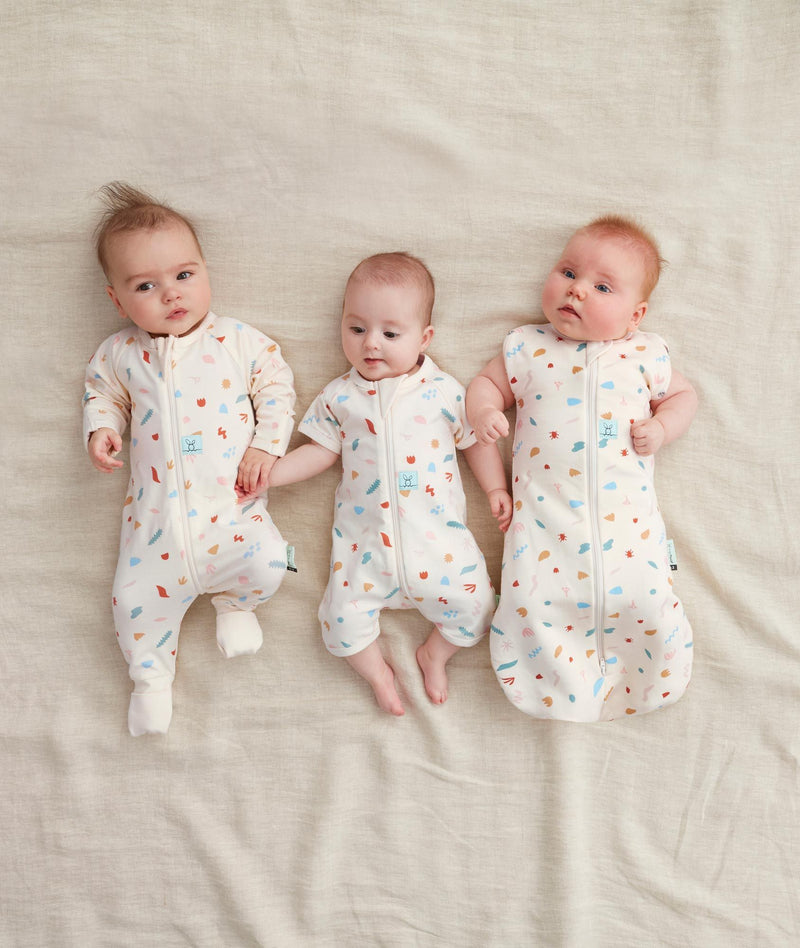 Three babies in ergoPouch sleepwear range in Desert Bloom