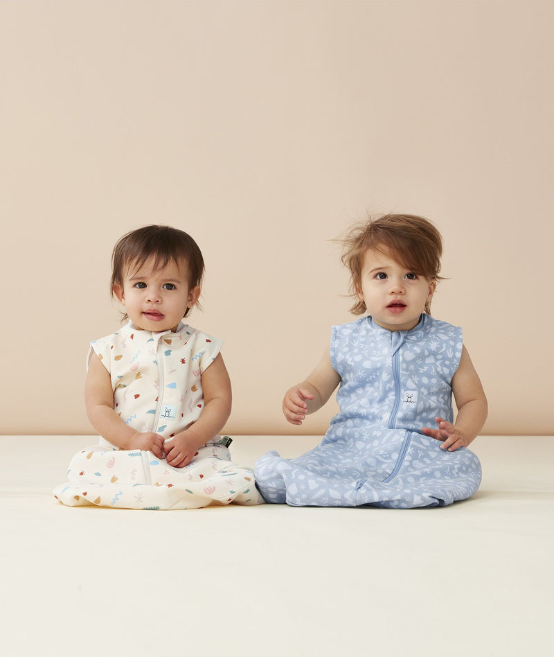 Two infants wearing ergoPouch Sleeping Bags