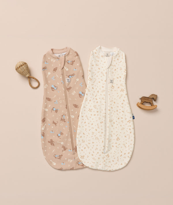 Flatlay of ergoPouch Cocoon Swaddle Bags in Lullaby and Melody