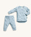 A light blue ergoPouch two-piece long sleeve baby pyjamas featuring a dragonfly print and a press stud opening on the shoulder.