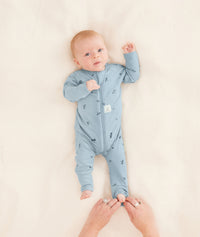 Long Sleeve Layer 2.0 TOG Dragonflies putting foot cuff on newborn