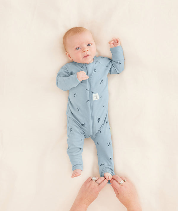 Long Sleeve Layer 2.0 TOG Dragonflies putting foot cuff on newborn