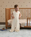 Toddler smiling with hands on hips, wearing a sleeveless convertible Sleep Suit Bag with separate legs.