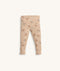 Beige patterned pyjama pants with ankle cuffs.