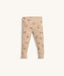 Beige patterned pyjama pants with ankle cuffs.