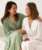 Mum drapes arm around the shoulder of grandmum, both wearing ergoPouch Matchy Matchy Robes