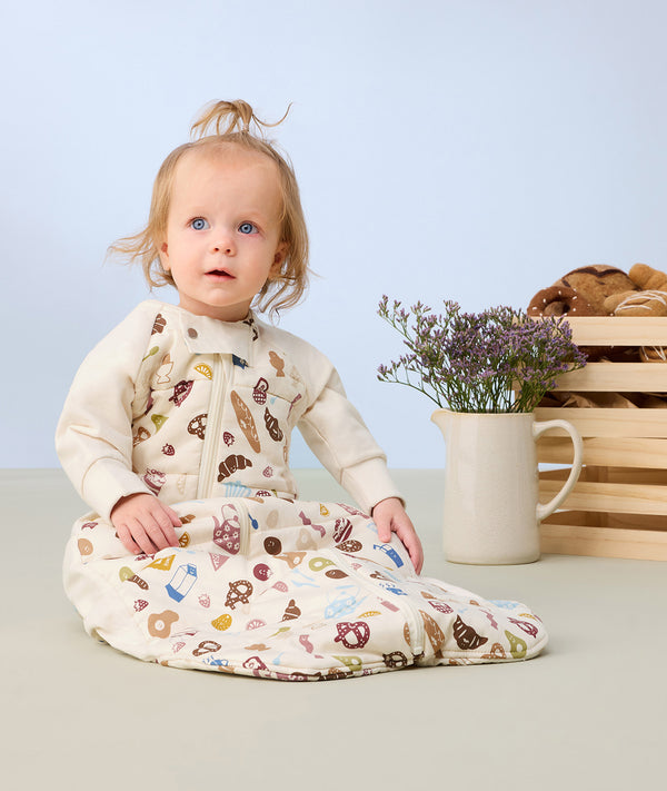Sleep Suit Bag Petit Pretzel infant sitting