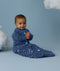 Baby wearing an ergoPouch Sleeping Bag 3.5 TOG Sleeved Starbeam