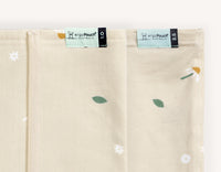Close-up view of the ergoPouch HugMe blanket, displaying the 1.0 and 2.5 TOG ratings, which can be used for  different room temperatures.