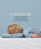 Toddler lying flat on a 3cm low-profile toddler pillow, with text explaining healthy spine alignment benefits.