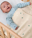 HugMe Blanket Daisy Sprinkle newborn in bassinet