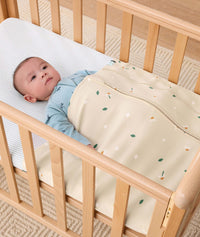 HugMe Blanket Daisy Sprinkle newborn tucked in