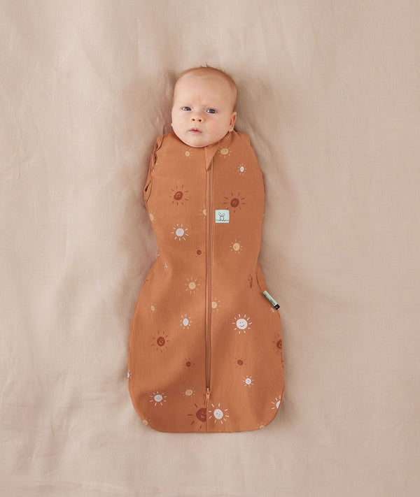 Baby wearing a Cocoon Swaddle Bag 1.0T Sunny