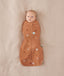 Baby wearing a Cocoon Swaddle Bag 1.0T Sunny