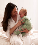 Mum wearing ergoPouch bamboo robe while cuddling her baby