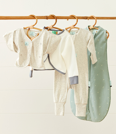 ergoPouch baby sleepwear, including a sleeping bag, romper, baby cardigan and arm sleeves