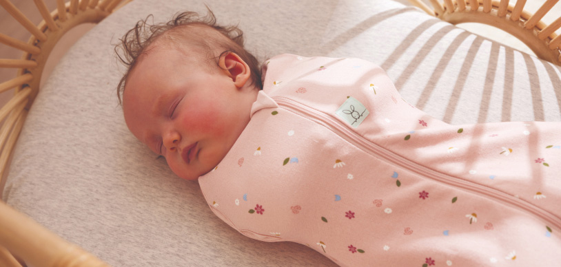 Baby wearing a cocoon swaddle bag