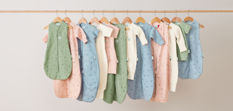 Wooden rack with a variety of ergoPouch baby and kids sleepwear product